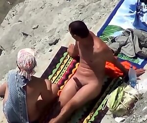 Two nude couples on the beach gets a sexy time